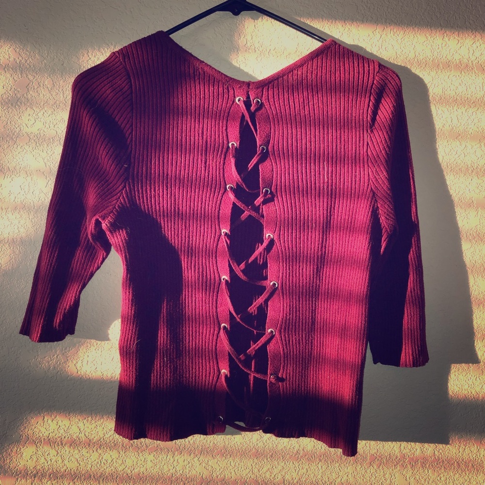Maybe EXPRESS Maroon sweater with lace up back.